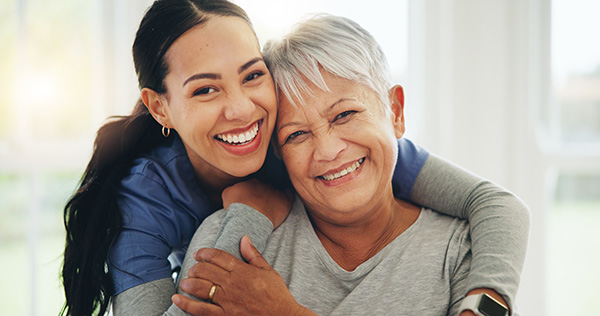 A carer with an elderly woman.