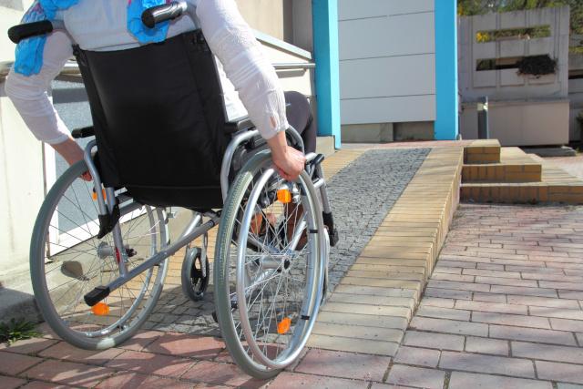 Wheelchair going up a ramp